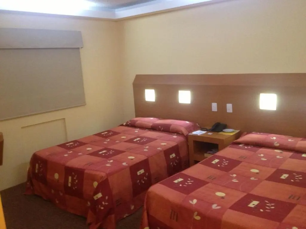 Twin beds in a Hotel Central guest room